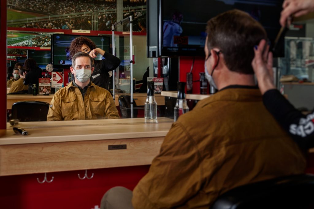 Many sectors took a haircut in 2020 and forced a lot of CEOs out of their comfort zones. Jeff Fritz, an investor in a chain of SportClips retail salons, gets a trim. Photo by John Wallace