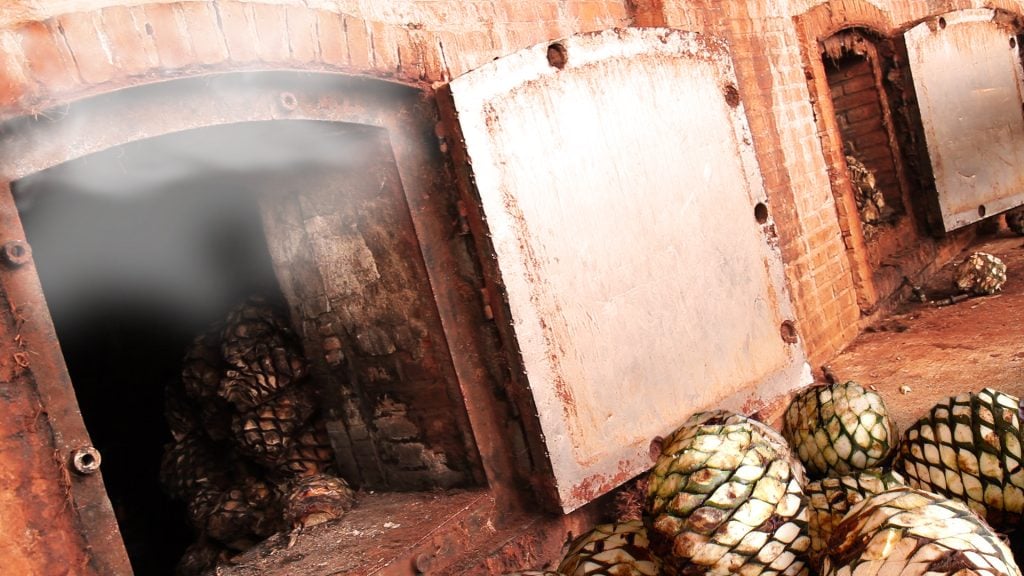 The process of steaming was adopted as a “modern” way to remove impurities from the agave, as well as increase production by allowing for more agave to be steamed at once. Credit: Clase Azul