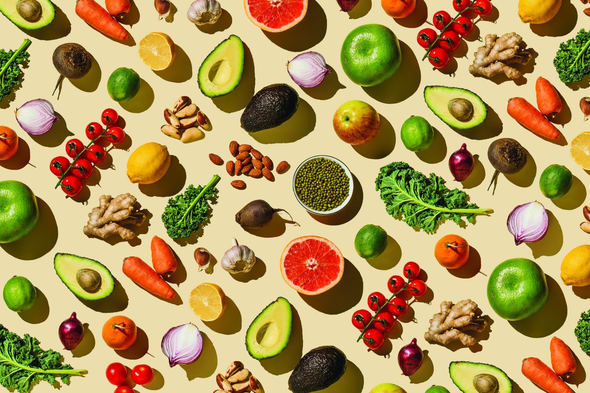 Pattern of variety fresh of organic fruits and vegetables and healthy vegan meal ingredients on beige background. Healthy food, clean eating, diet and detox, eco friendly, no plastic concept . Flat lay, top view